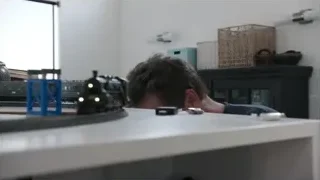 man with model train on countertop — Elon Musk: Return to Space