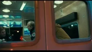 ambulance with flashing lights on city street — Joker