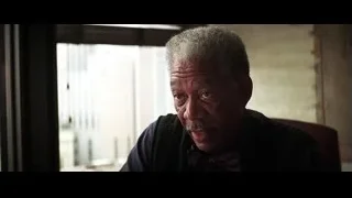 elderly man in sweater looking at camera — Batman: The Dark Knight