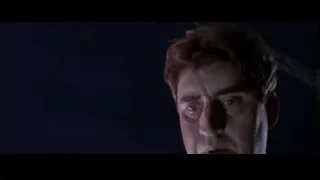 Shirtless man looking serious in dark room — Spider Man 2
