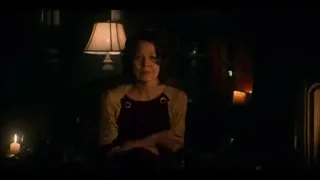 woman sitting in dimly lit room with candles — Peaky Blinders