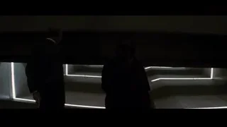 Man and woman in futuristic control room — Batman: The Dark Knight Rises