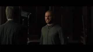 two men facing each other in dim light — Creed 2