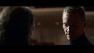 man and woman in dimly lit room — Steve Jobs