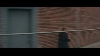 Man walking on sidewalk near truck — Now You See Me