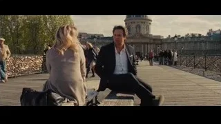 man and woman on bench on Paris bridge — Now You See Me