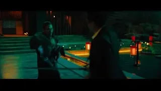 two men with sword in dimly lit room — John Wick: Chapter 4
