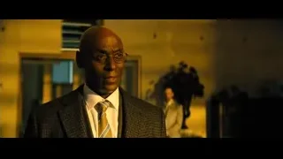 man in suit in dimly lit room — John Wick: Chapter 4