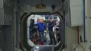 Men in space station control room — Elon Musk: Return to Space