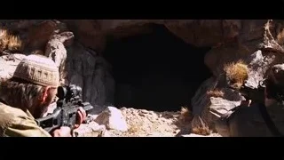 two men with rifles in cave — Iron Man