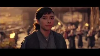 Woman in robe before crowd with lanterns — Doctor Strange 2