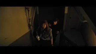 Man and woman in dimly lit alley — Now You See Me