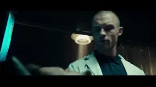 bald man in blazer serious expression — Deadpool