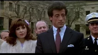 man in suit and woman in fur coat — Rocky III