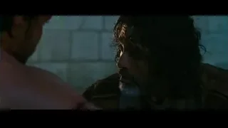 two men conversing in dim room — Gladiator 2