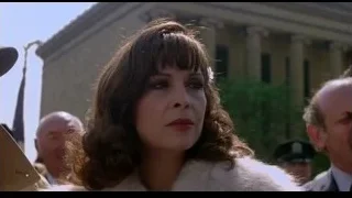 woman in fur coat looking off to side — Rocky III