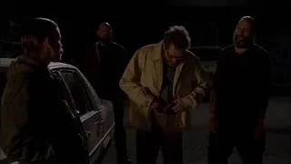 Four men with gun in dark parking lot — Breaking Bad
