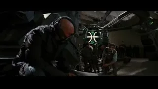 man in helmet working on machine in spaceship — Batman: The Dark Knight Rises