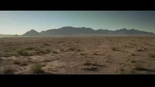 vast desert landscape with mountains — Creed 2