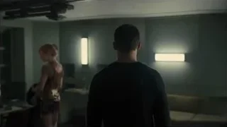 man and woman in dimly lit room — Blade Runner 2049