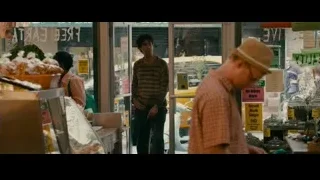 man looking at counter in bakery store — The Dictator