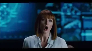 woman speaking to man in dark room — Jurassic World