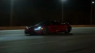 red sports car driving on highway at night — Sports Cars