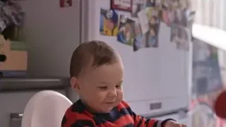 young child in high chair playing with ball — Screened Out