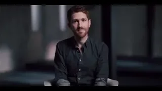 man sitting in chair in dark room — The Social Dilemma