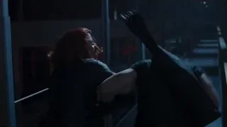 man with gun confronting woman in dark room — The Avengers