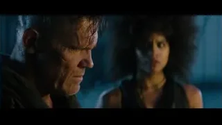 man and woman in dark eerie cave — Deadpool 2