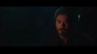 Close-up of man's serious face in dark — Iron Man