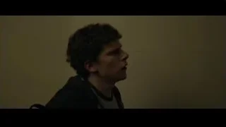 Man deep in thought in dimly lit room — The Social Network