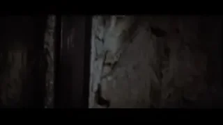 Shirtless man in dark room with stone wall — Bruce Lee: Enter The Dragon