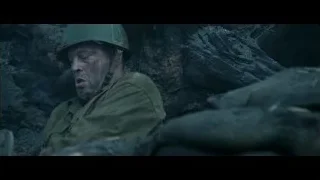 man in military uniform smiling in cave — Hacksaw Ridge