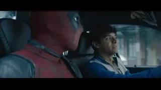Deadpool sitting in car driver's seat — Deadpool 2