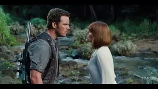 Man with rifle and woman by river — Jurassic World