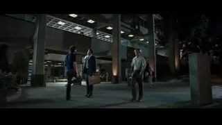 Two men conversing in modern building at night — Jobs