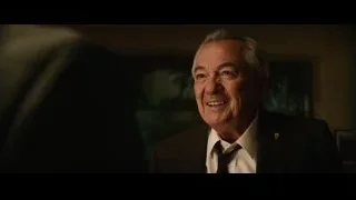 elderly man portrait in dark suit — Ford v Ferrari