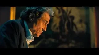 elderly man in dark suit looking down — John Wick: Chapter 4