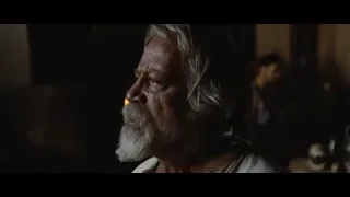 elderly man's face in dimly lit room — Gladiator