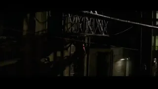 person on scaffolding at night — Bruce Lee: Birth of The Dragon