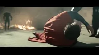 Man lying on ground near fire — Superman: Man of Steel