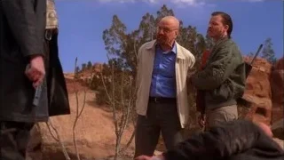 Three men in desert, one with gun — Breaking Bad