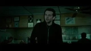 Man standing in dimly lit room — Limitless