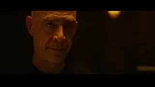 bald man on phone with serious expression — Whiplash