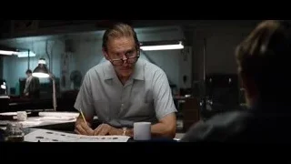 man working at desk in office — Ford v Ferrari