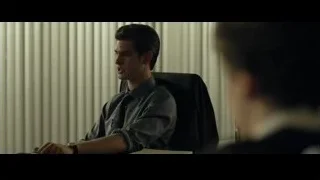 young man sitting at office desk — The Social Network