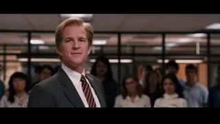 Man in suit speaking to group in office — Jobs