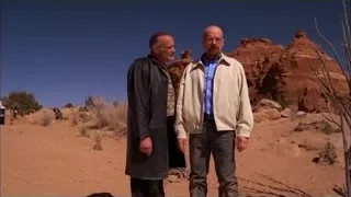 two men talking in desert with red rocks — Breaking Bad